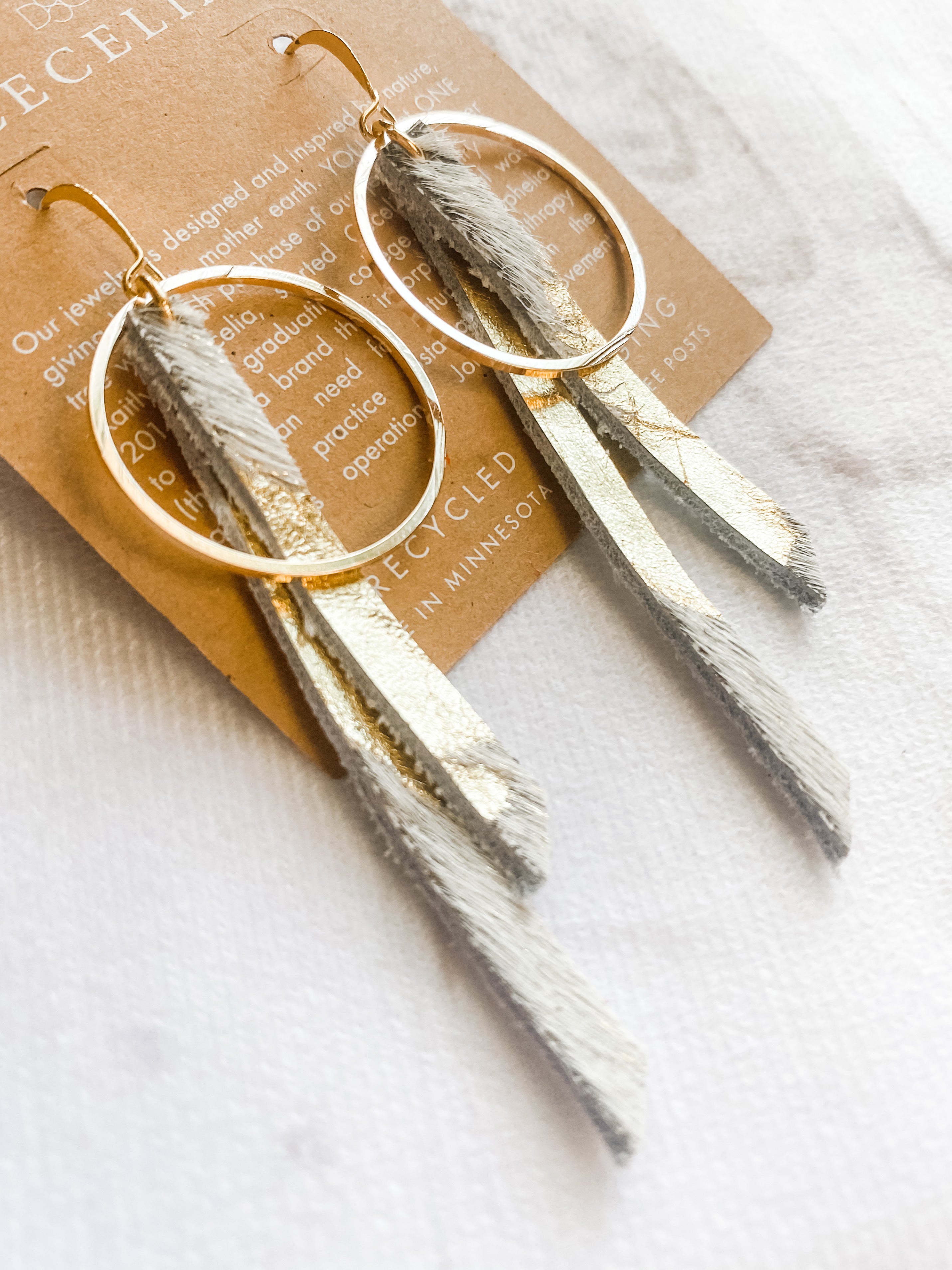 Gold Cow Hide Tassel Hoop Earrings